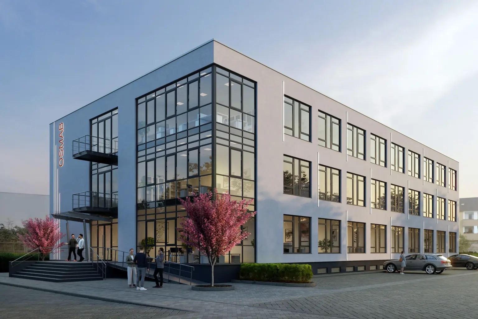 Zeitgenössisches Bürogebäude mit Glasfassade und Parkplätzen in Hamburg.